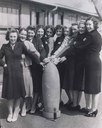 Kirkby factory workers around a bomb, black-and-white photograph, Great Britain, unknown date [between 1939 and 1945], unknown photographer; source: National Museums Liverpool, http://www.liverpoolmuseums.org.uk/nof/blitz/0700_info.html.