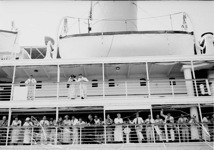 Passenger ship leaving the Dutch East Indies, black and white photograph, between 1920 and 1938, photographer: Christoffel Hendrik Japing; source: Tropenmuseum of the Royal Tropical Institute (KIT) Amsterdam, wikimedia commons, http://commons.wikimedia.org/wiki/File:COLLECTIE_TROPENMUSEUM_Serpentineslingers_bij_het_vertrek_van_een_passagiersschip_Nederlands-Indi%C3%AB_TMnr_10030173.jpg  Creative Commons Attribution-Share Alike 3.0 Unported license.